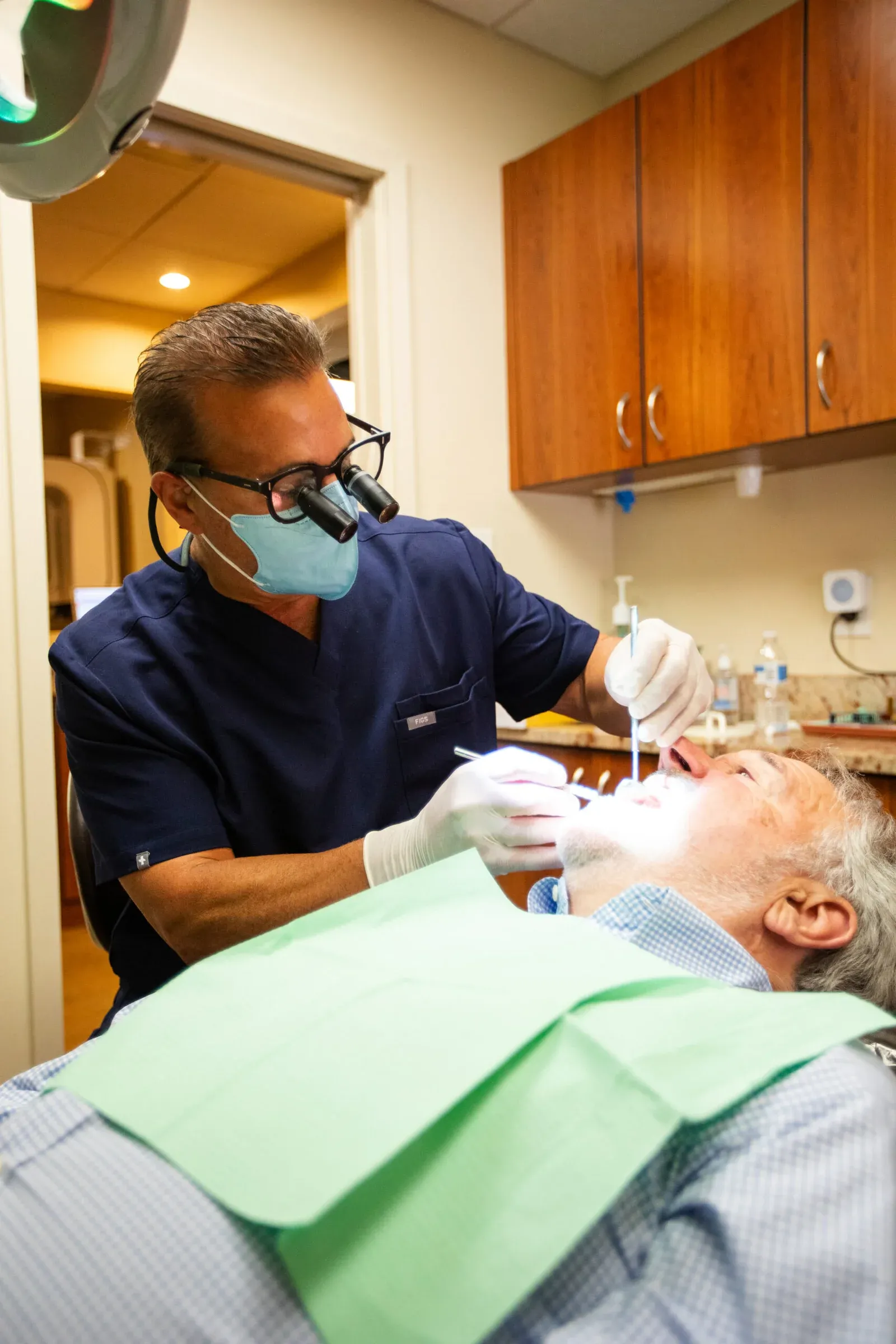 Dr. Matthew Bellafiore examining a patient's teeth at Creative Dentistry of Brooklyn Heights